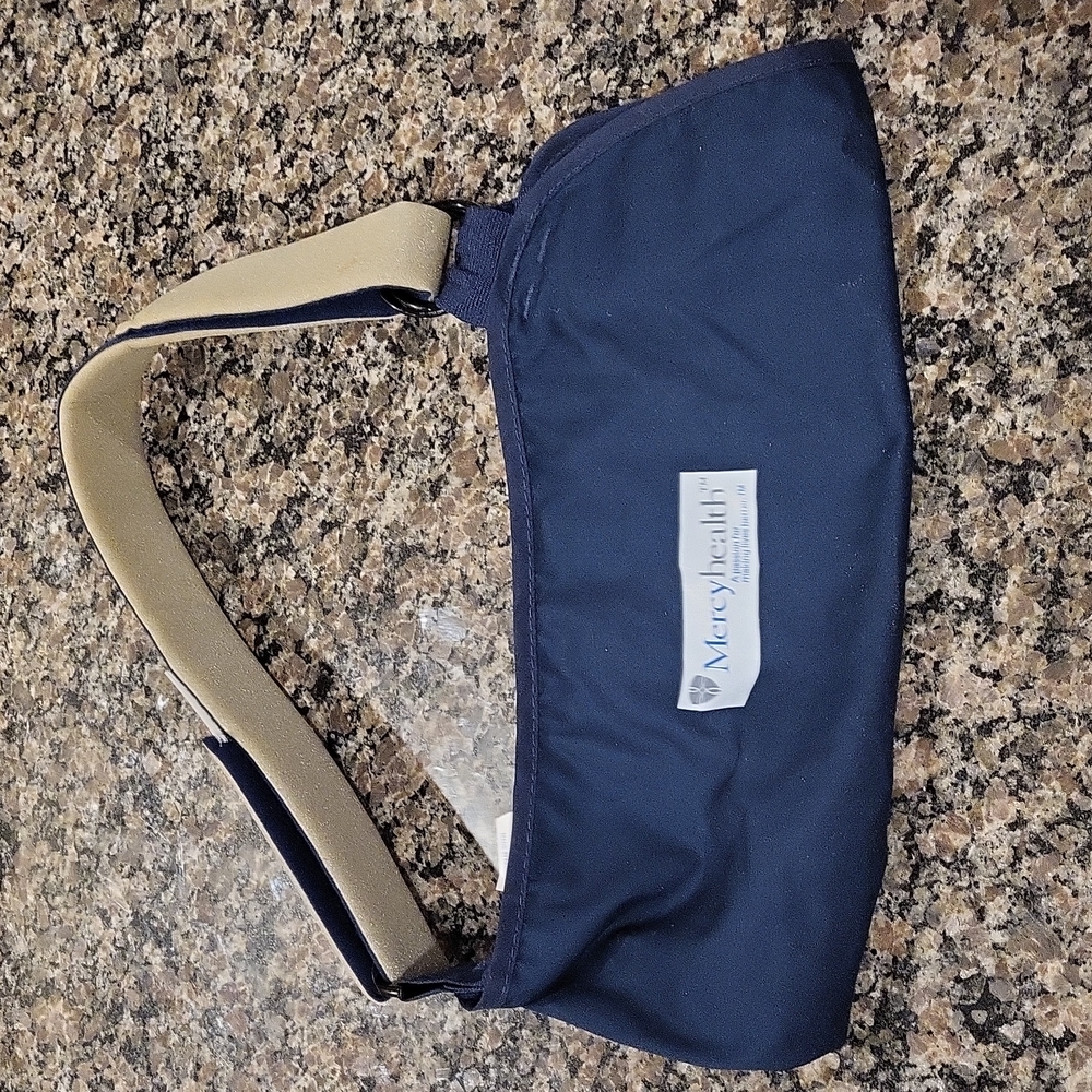 Mercy Sling Elbow adjustable sling left or right blue color like new size LARGE